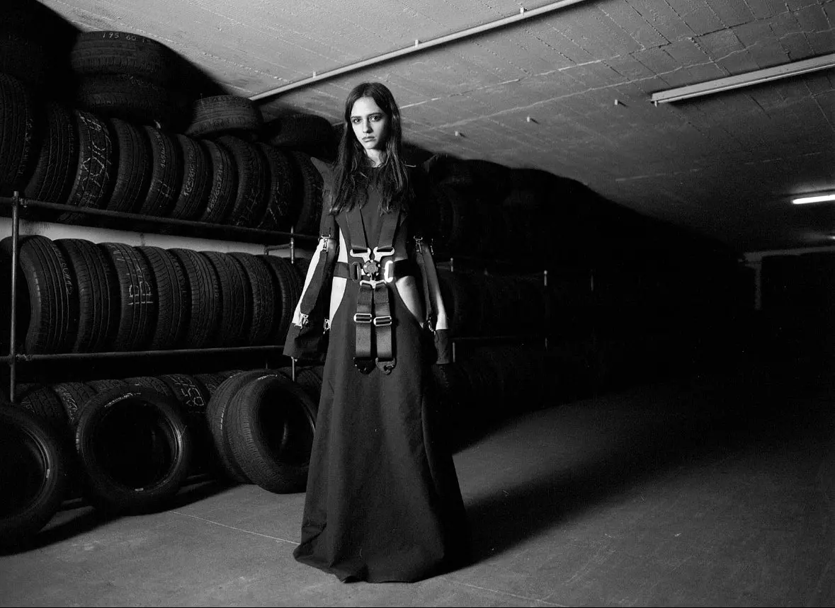 Racing 6-Point Belt Dress — in a tyre warehouse, black and white