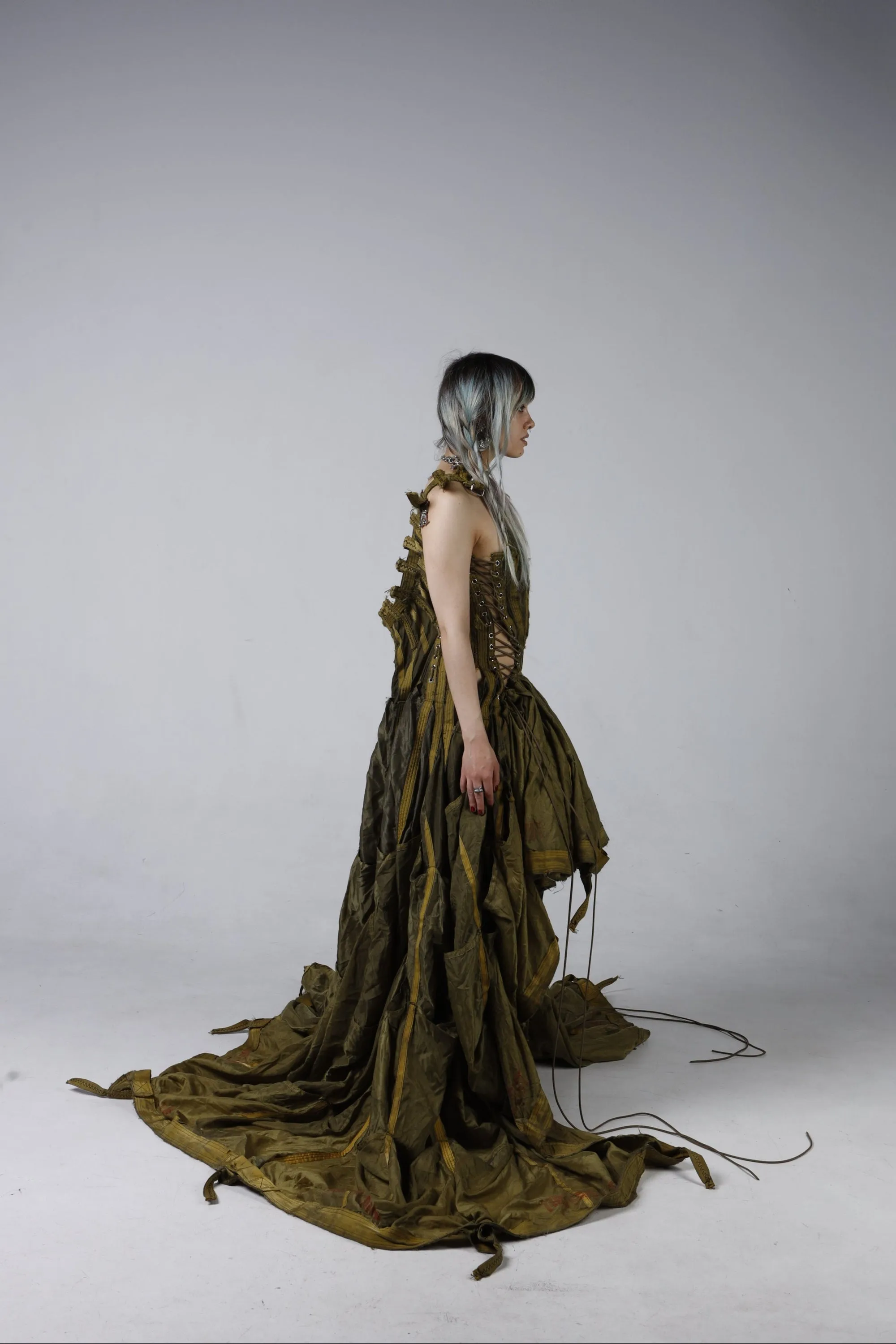 Parachute Dress — three-quarter view with olive-green parachute silk cascading to the floor