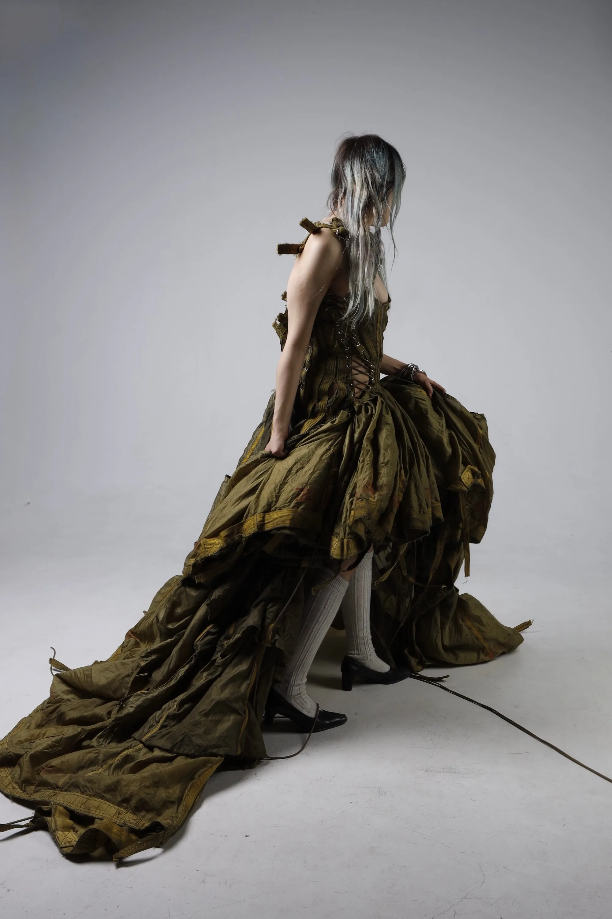 Parachute Dress — model kneeling, dress pooling on the floor