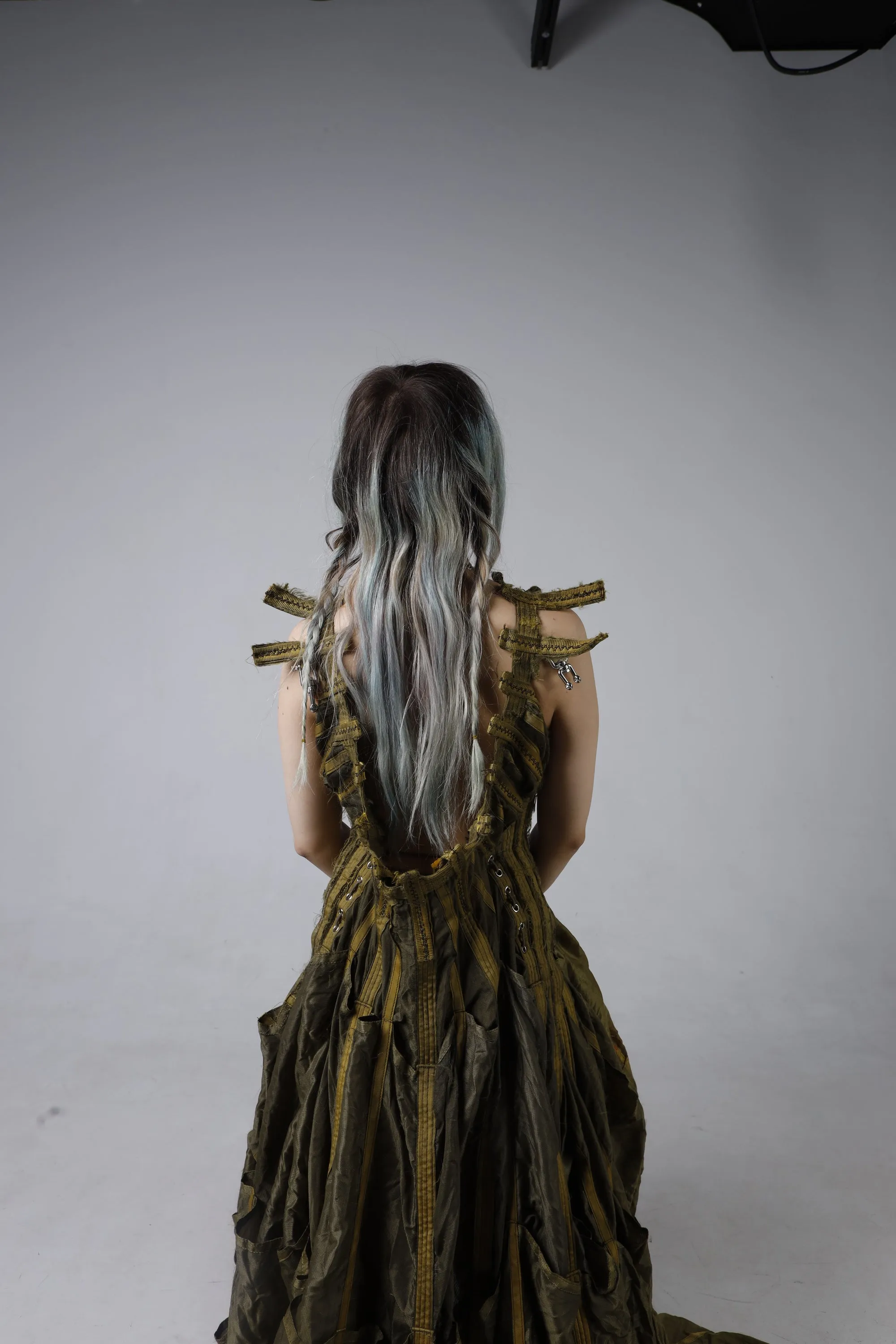 Parachute Dress — back view, hair down over the laced bodice