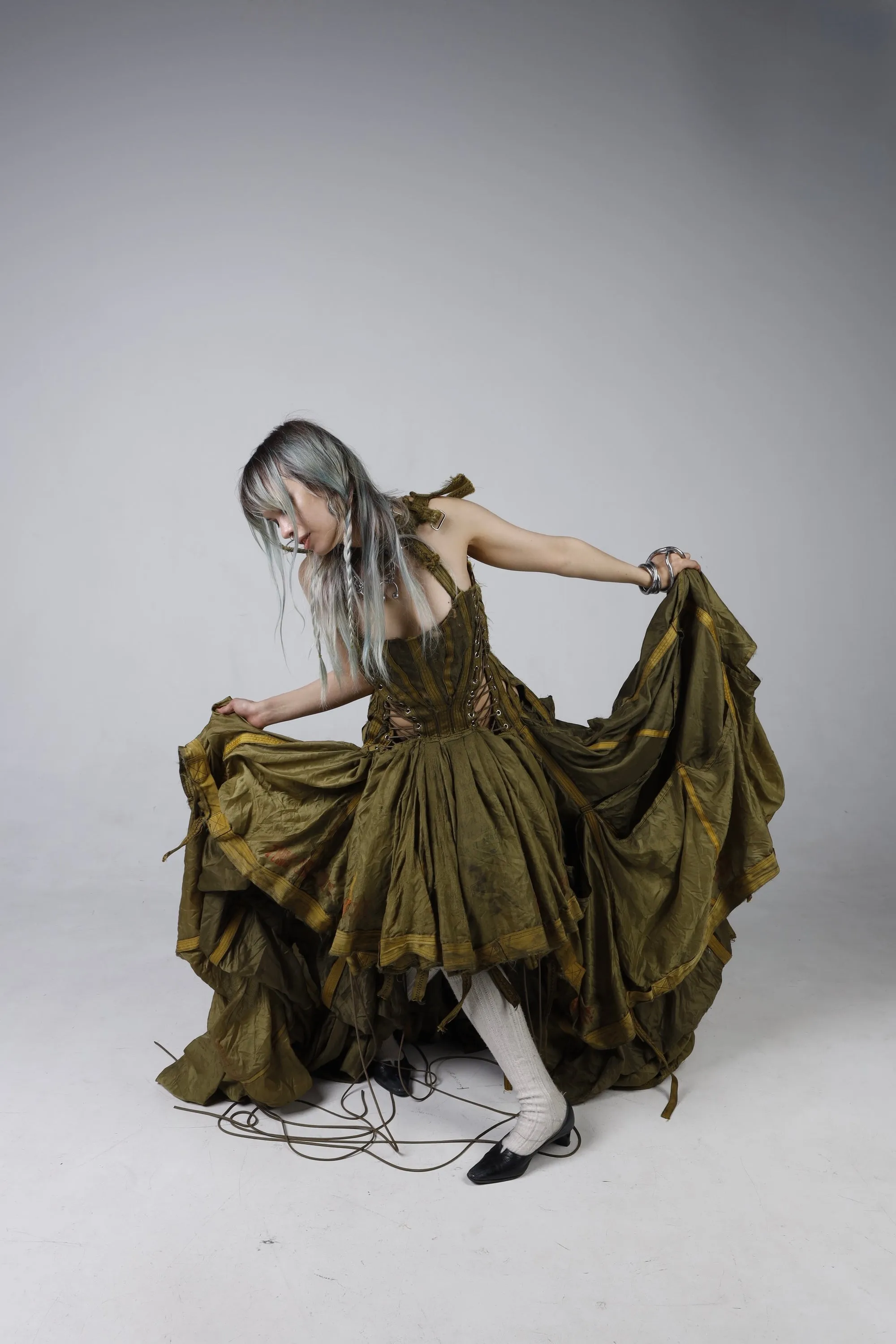 Parachute Dress — model gathering the skirt